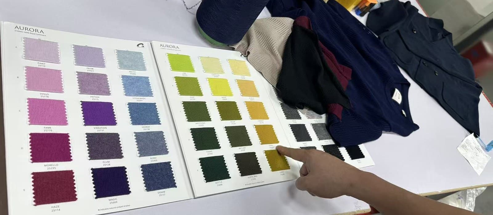 Development samples laid out during a knitwear design review