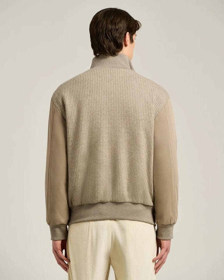 Knit bomber jacket with woven sleeves shown across its colourway range and construction detail