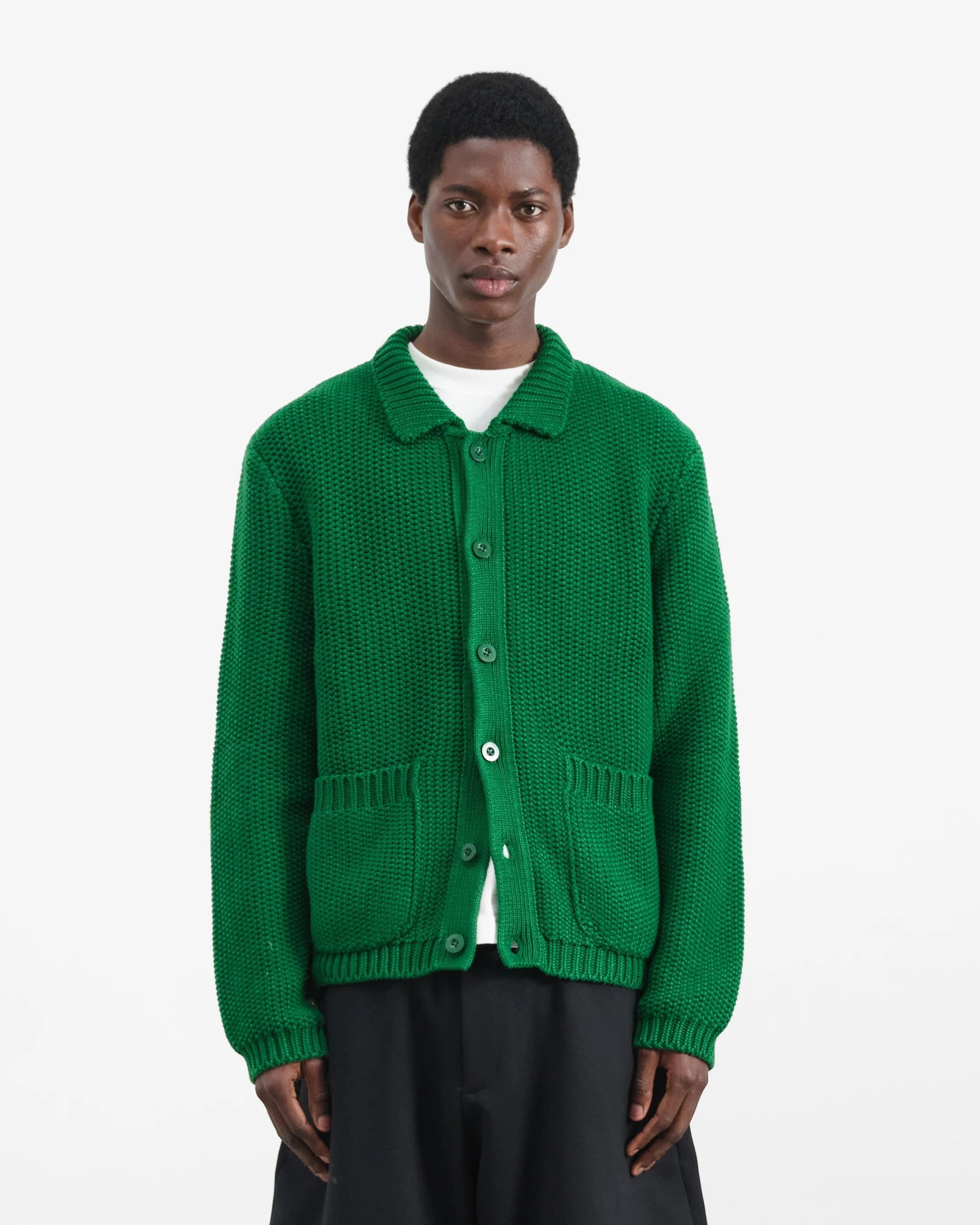 Chunky button cardigan worn as a layer