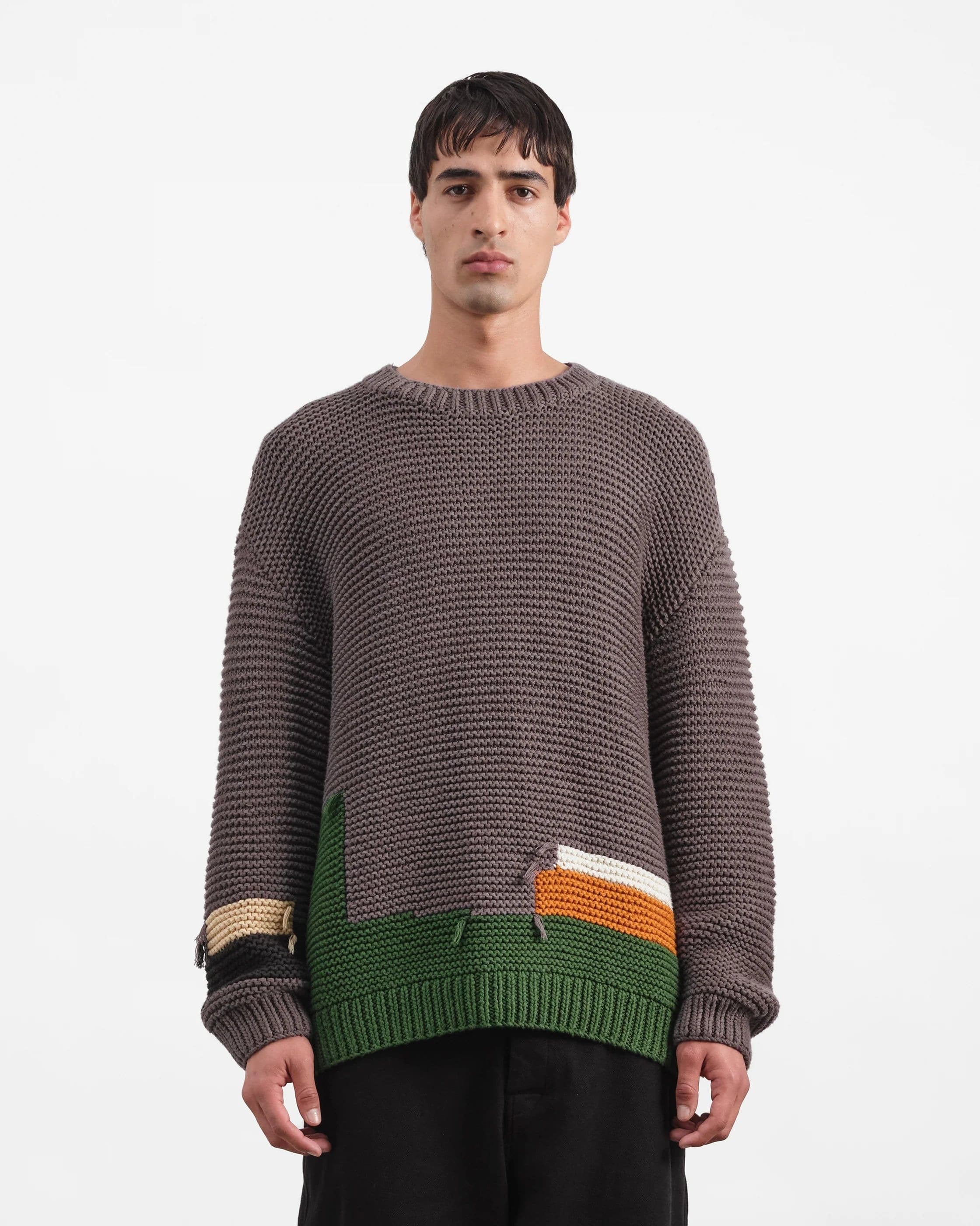 Patchwork crew neck as a trend statement knit