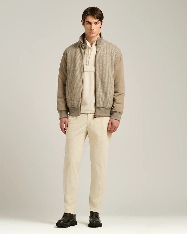 Knit bomber jacket with woven sleeves shown across its colourway range and construction detail