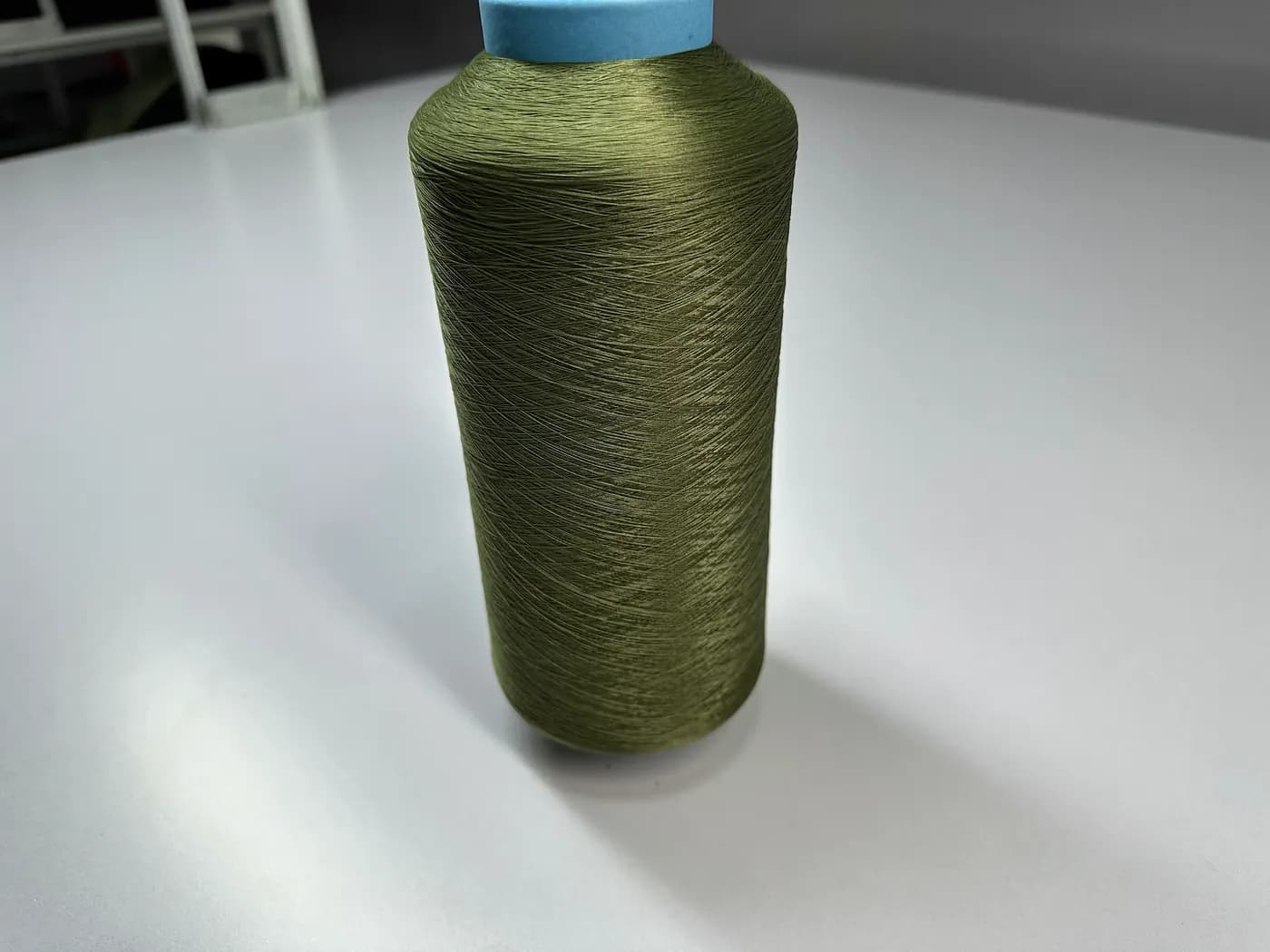 Close-up of knitwear yarn on cones
