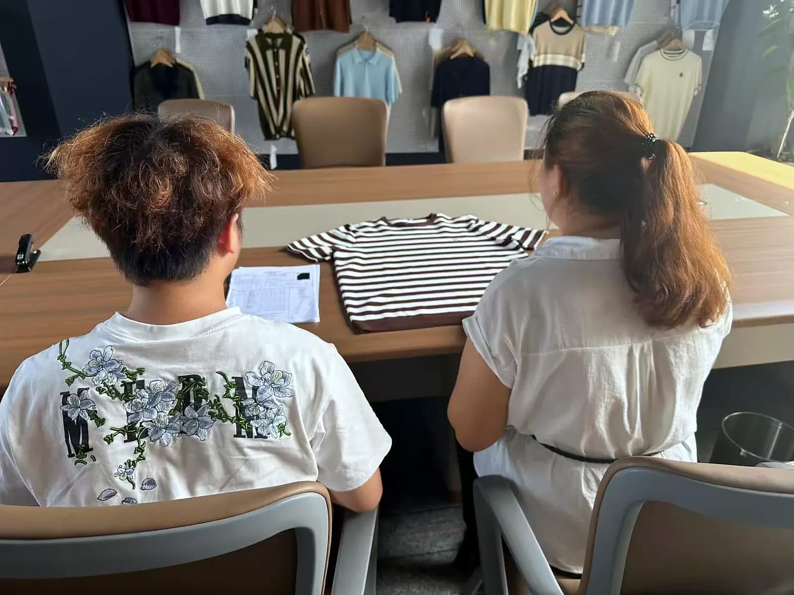 Samples and paperwork reviewed together at the meeting table