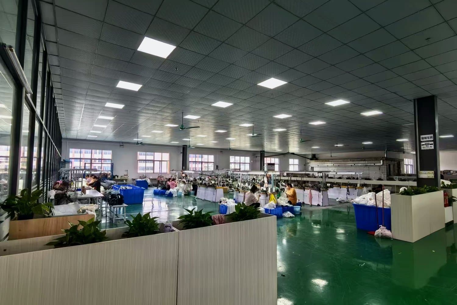 Licheng Knitwear showroom with sweaters, yarn and swatches
