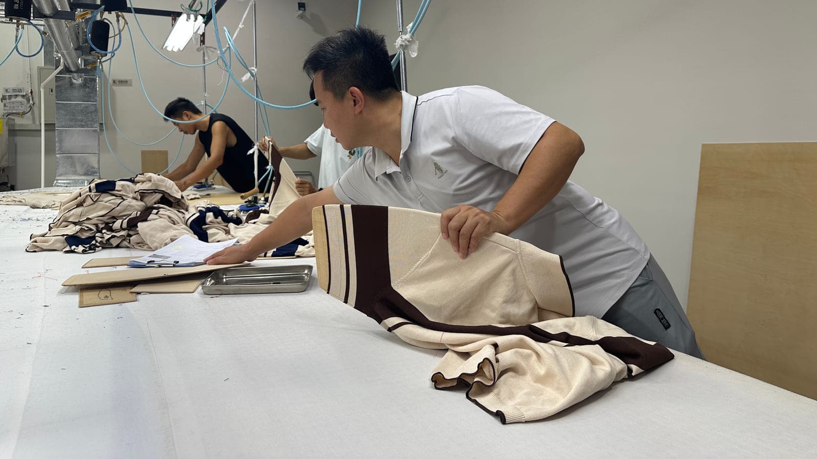 Finished knitwear checked for quality at the Licheng Knitwear factory