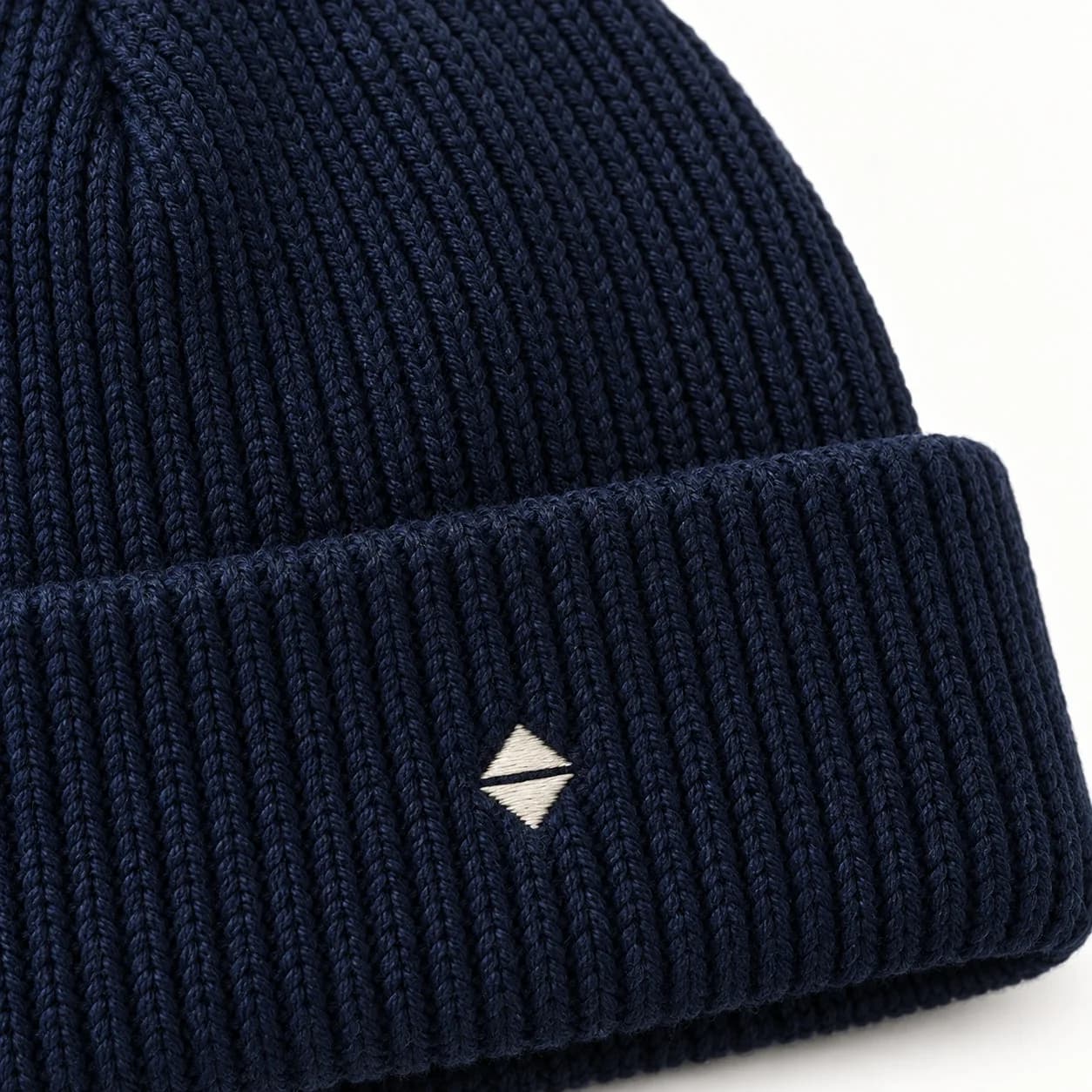 Private-Label Ribbed Logo Beanie - texture reference (AI development concept)