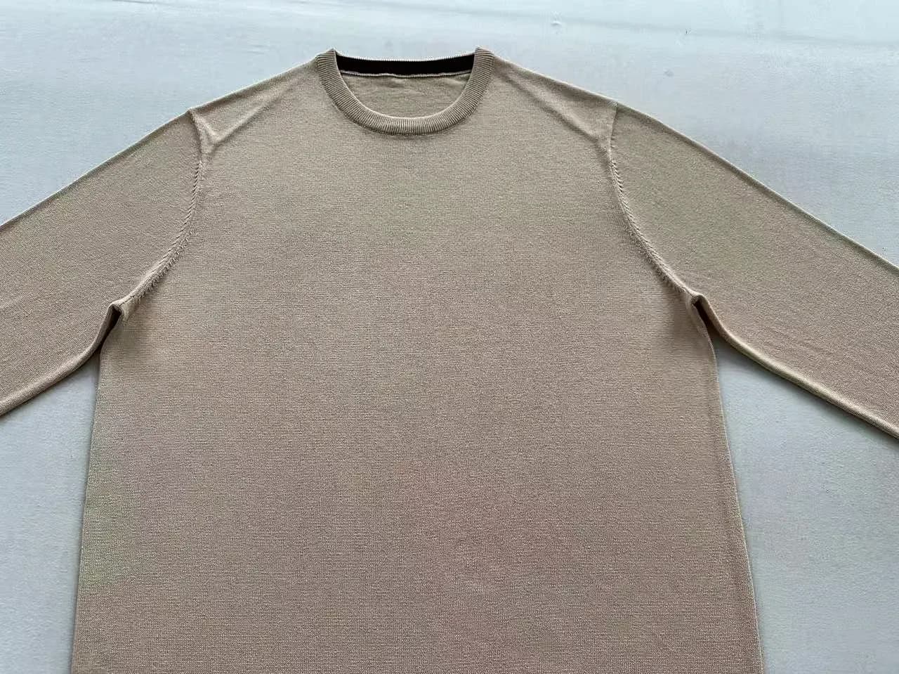 Knit sample laid flat for shape and measurement reference.