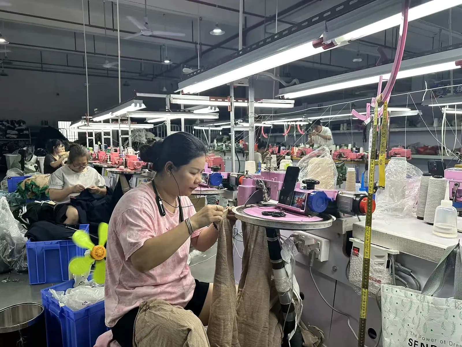 Linking and sewing workstations on the Licheng Knitwear production floor.