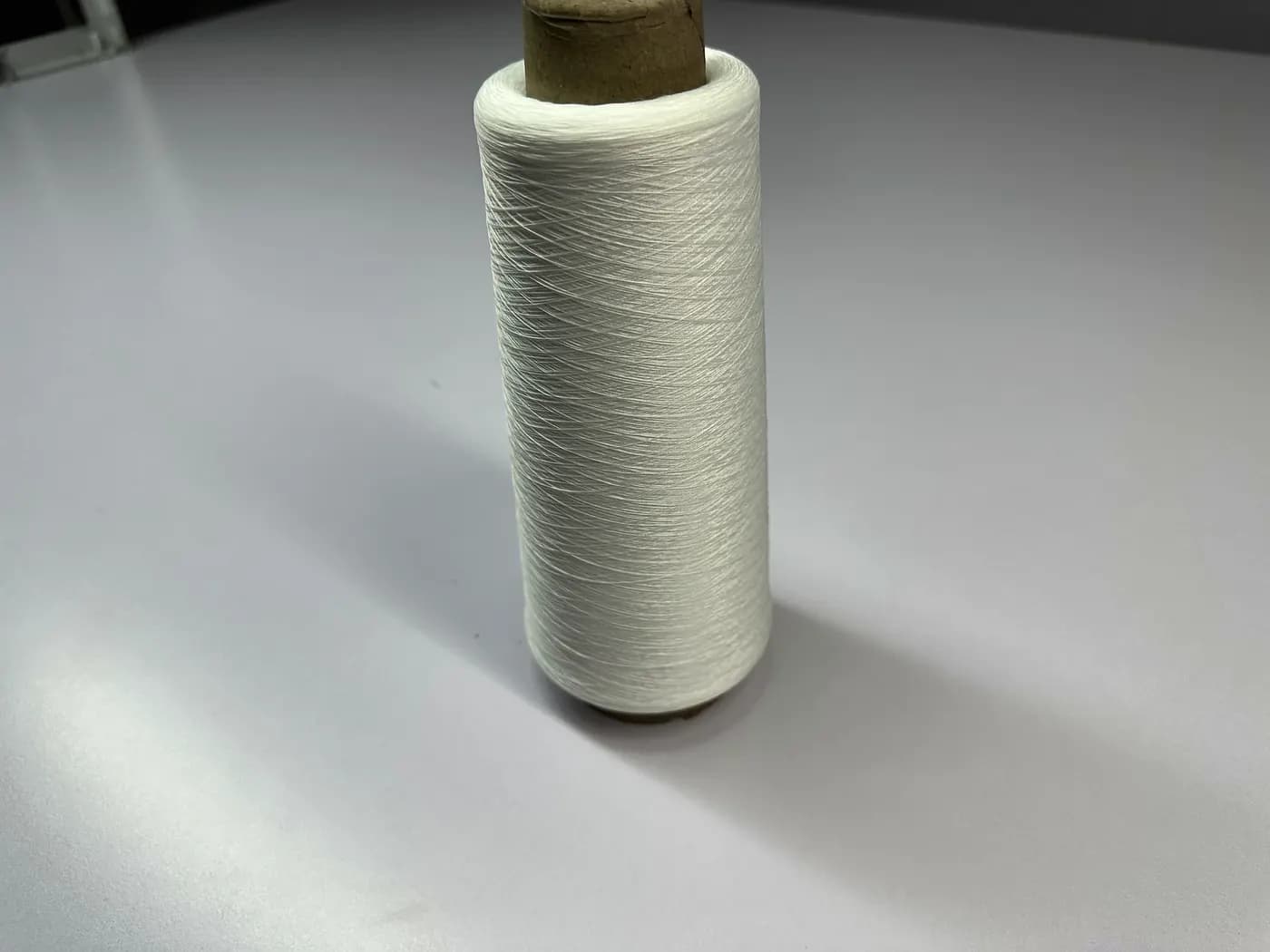 Close-up of knitwear yarn on cones