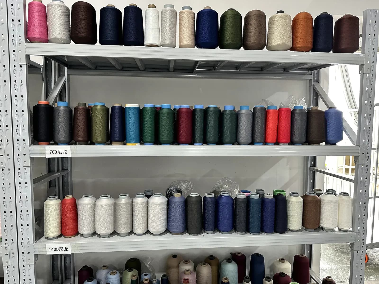 Yarn inventory supporting knitwear programmes across export markets.
