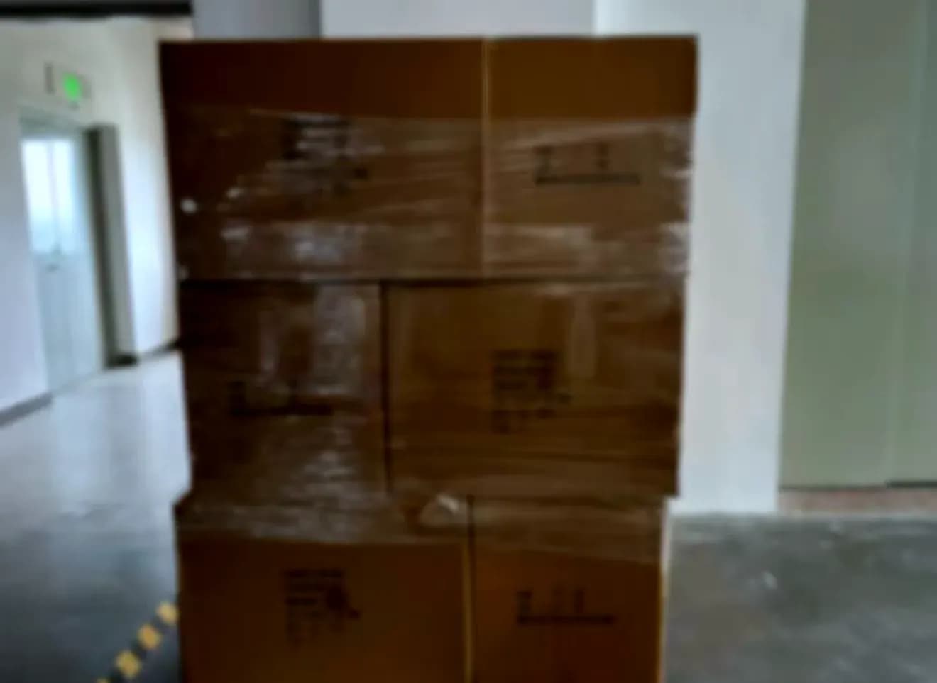 Unbranded export cartons stacked and wrapped