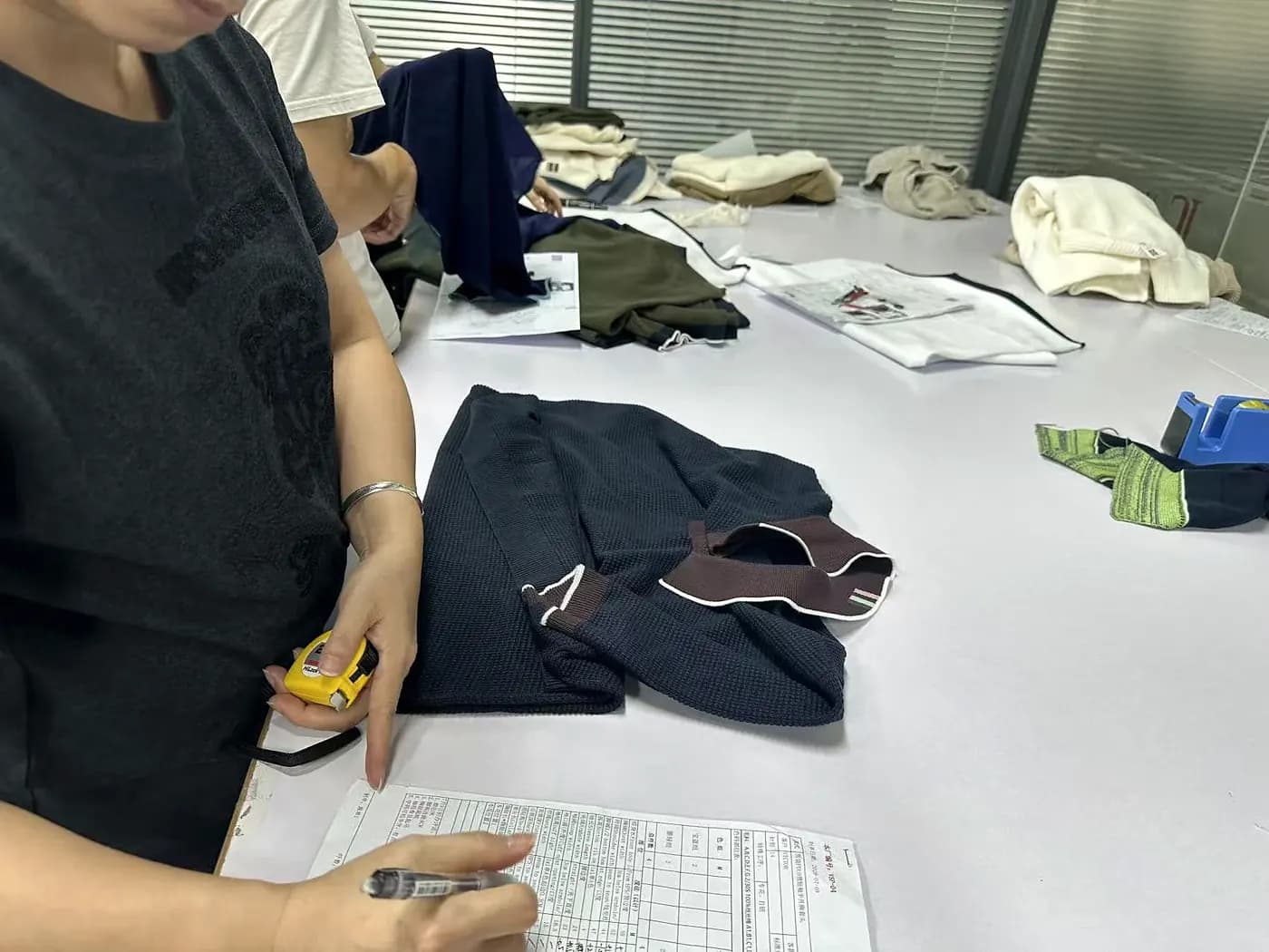 Garments laid out on the inspection table for checking