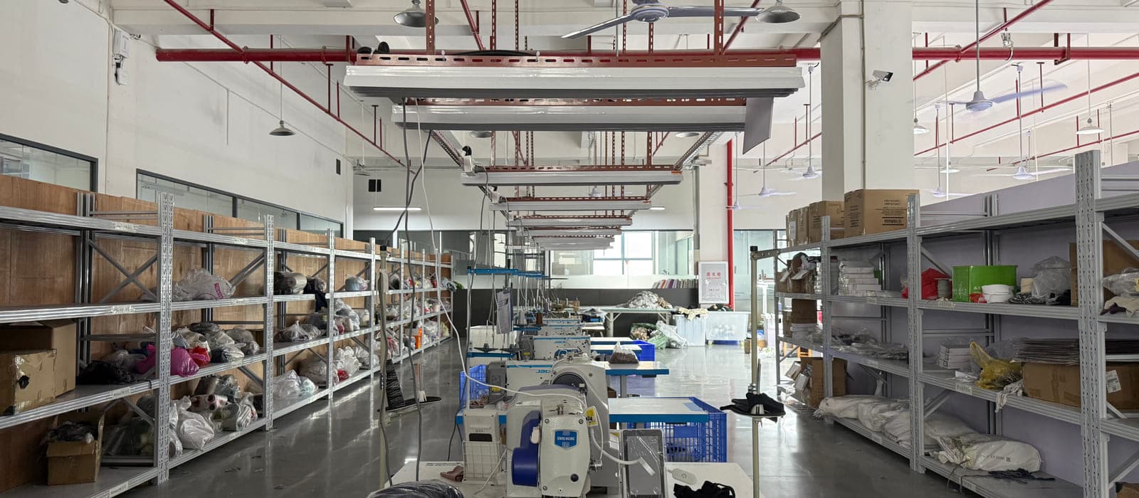 Production aisle with staged goods awaiting packing