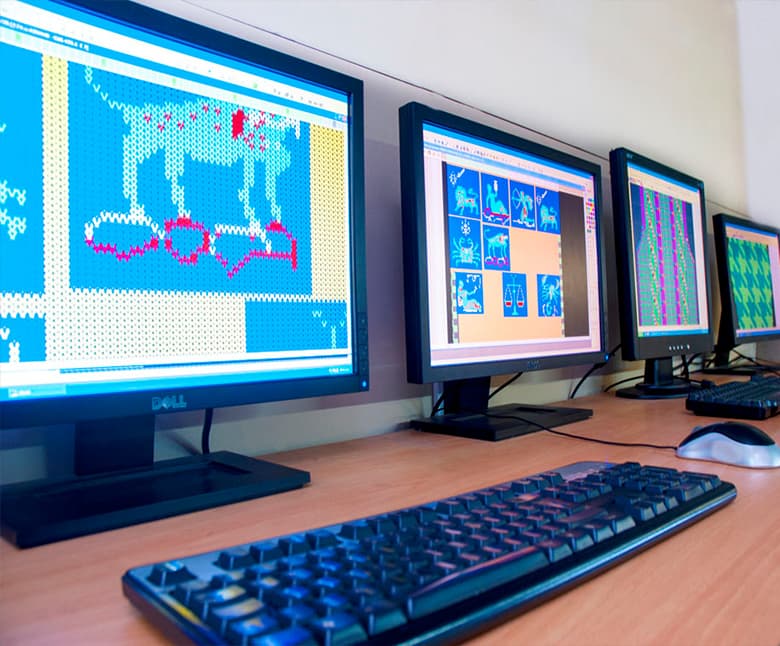 Knit pattern and jacquard design programming on computer screens in the factory